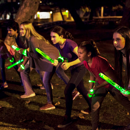 a game of tag in the dark with glow stick for new year party