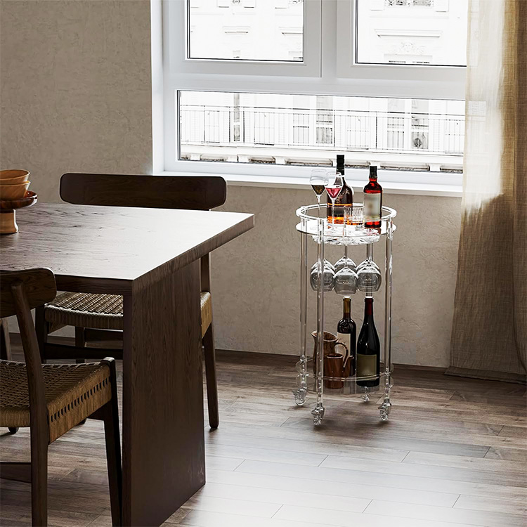 the transparent, cylinder-shaped bar cart
